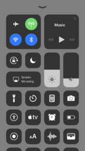 The iOS control centre screen shown with Reduce Transparency on. The background of the control centre is opaque.