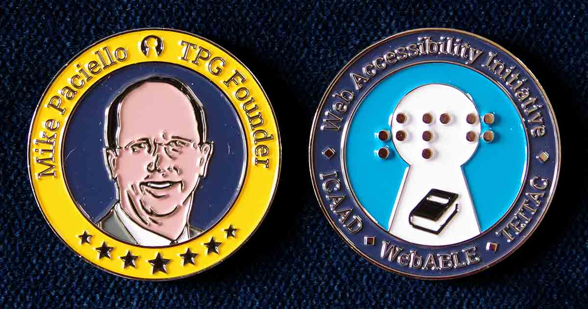The front and back of the coin. The front has Mike’s face, name, and company name. The back has the TPGi logo (also in Braille), and the names of WAI, ICAAD, TEITAC, and WebABLE,