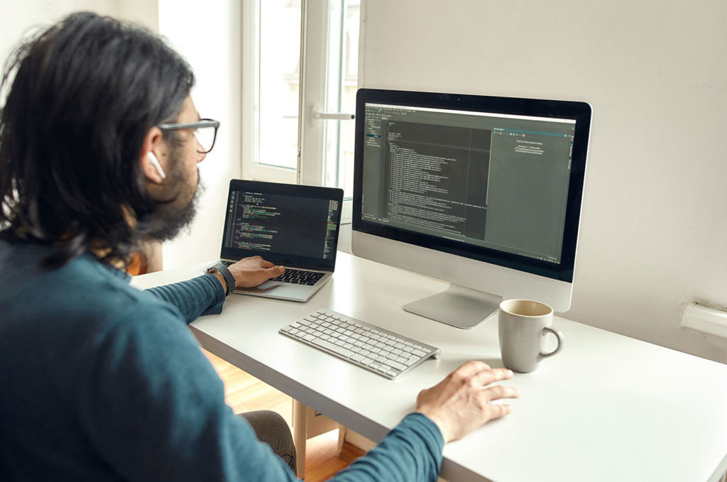 accessibility engineer at computer supporting customers on the phone
