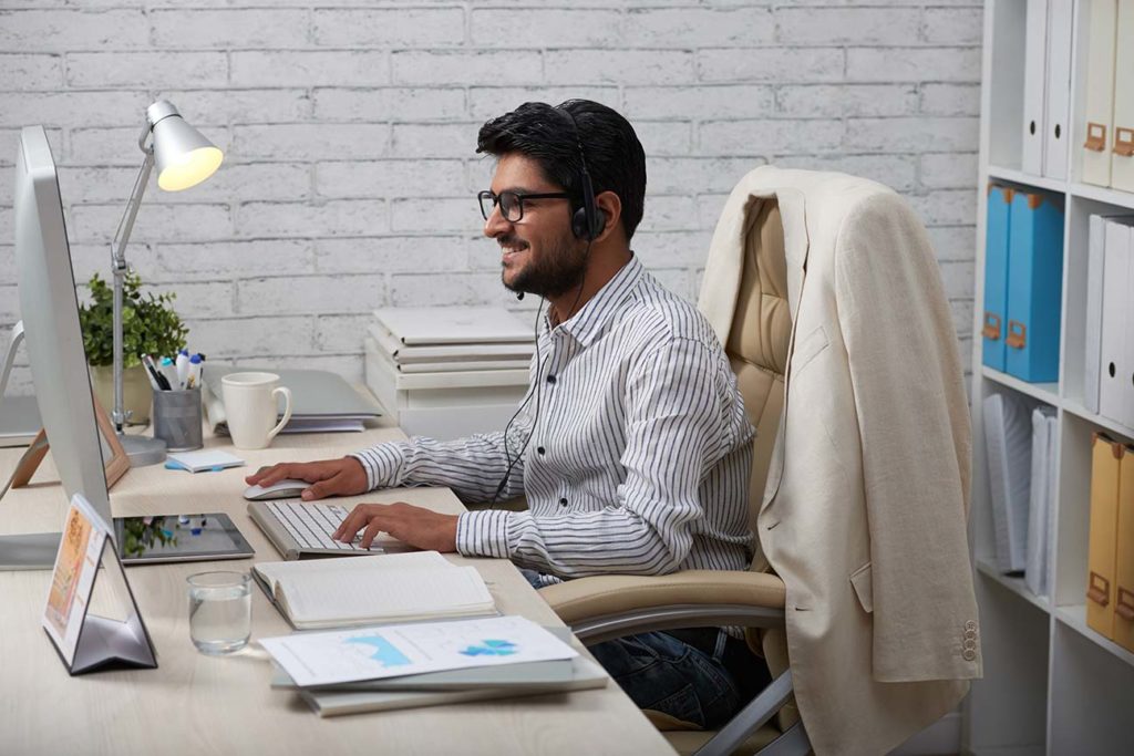 TPGi support person at a desk with his computer working