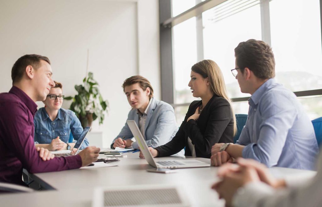 photo of accessibility engineers meeting with a client