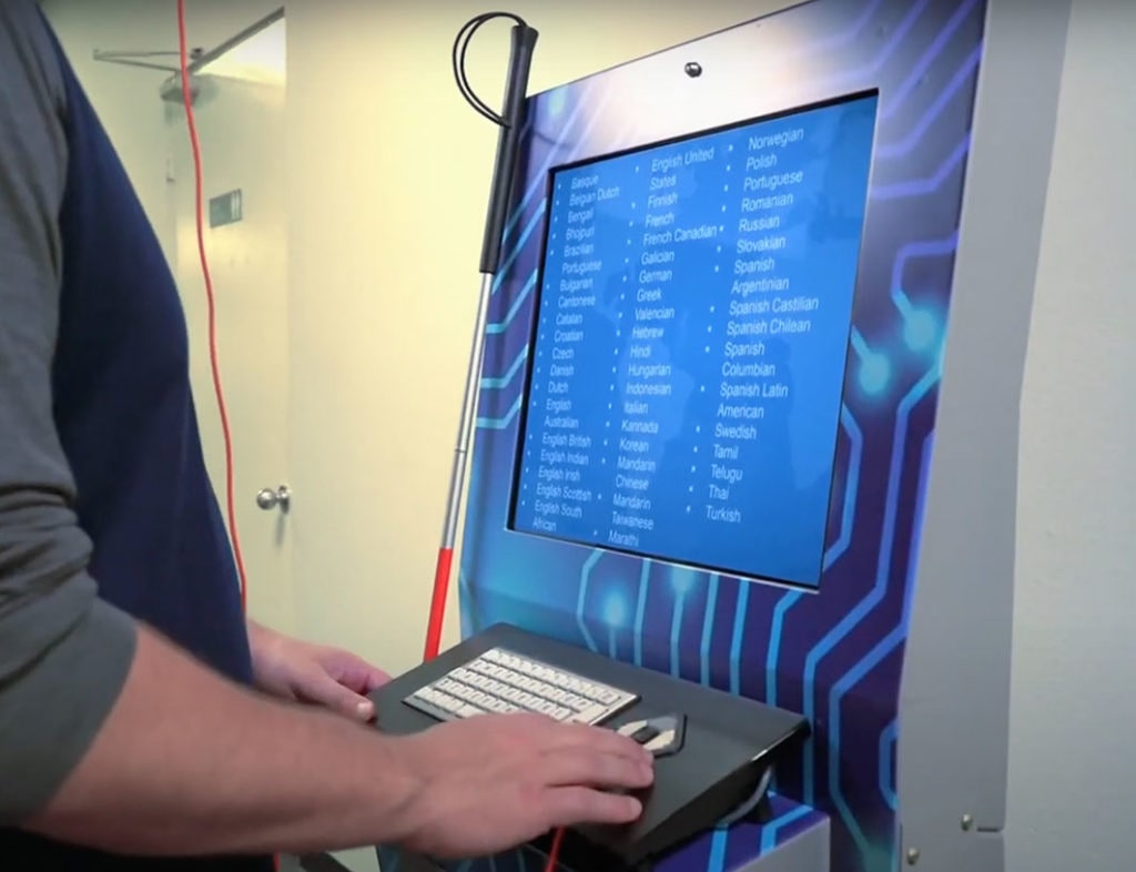 blind person using a kiosk with the help of JAWS
